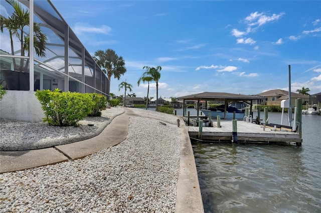 927 Golf Island Dr, Apollo Beach, FL 33572 - dock featuring a water view, boat lift, a residential view, and a lanai