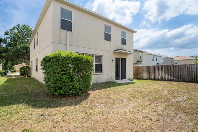18837 Litzau Ln, Land O Lakes, FL 34638 - rear view of property with stucco siding