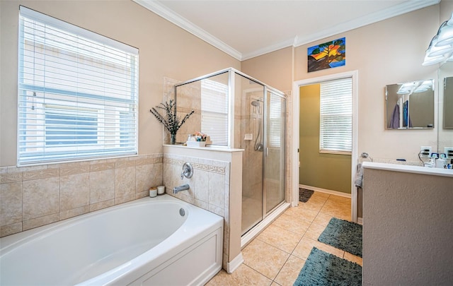 bathroom featuring crown molding, tile patterned flooring, a garden tub, and a shower stall