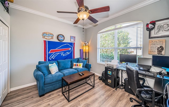 office space featuring crown molding, baseboards, and wood finished floors