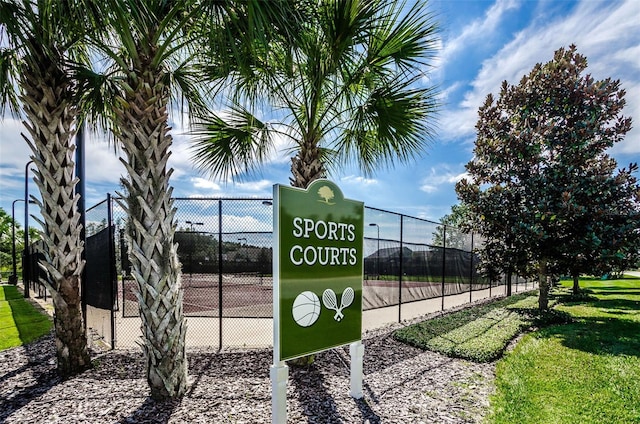 view of property's community featuring fence