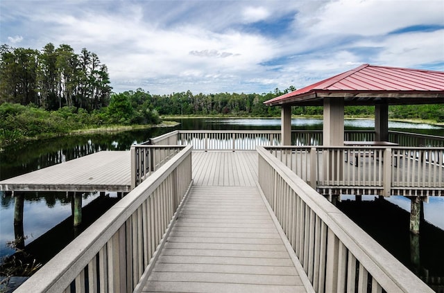 dock area with a gazebo and a water view