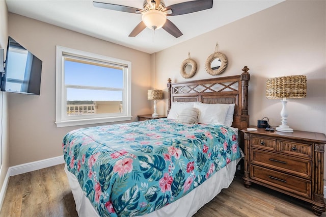19418 Gulf Blvd Unit 507, Indian Shores, FL 33785 - bedroom with wood finished floors and a ceiling fan