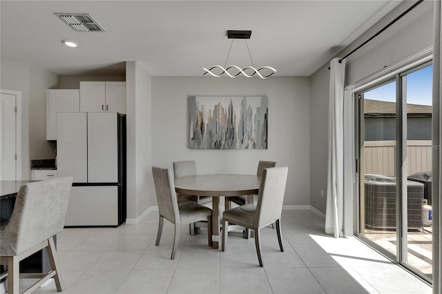 dining room with light tile patterned floors, baseboards, recessed lighting, and visible vents