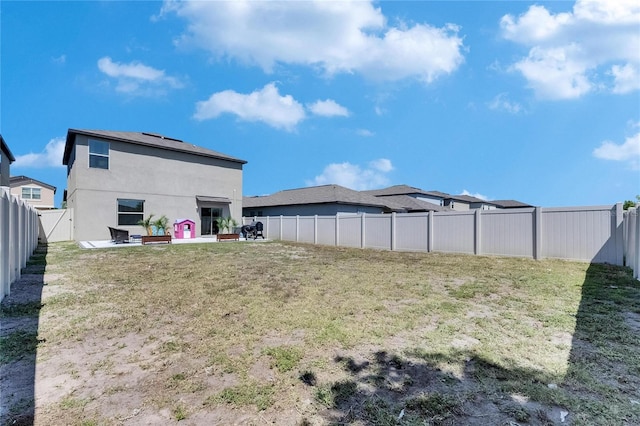 view of yard with a fenced backyard and a patio area