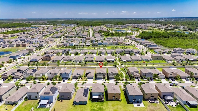 bird's eye view with a water view and a residential view
