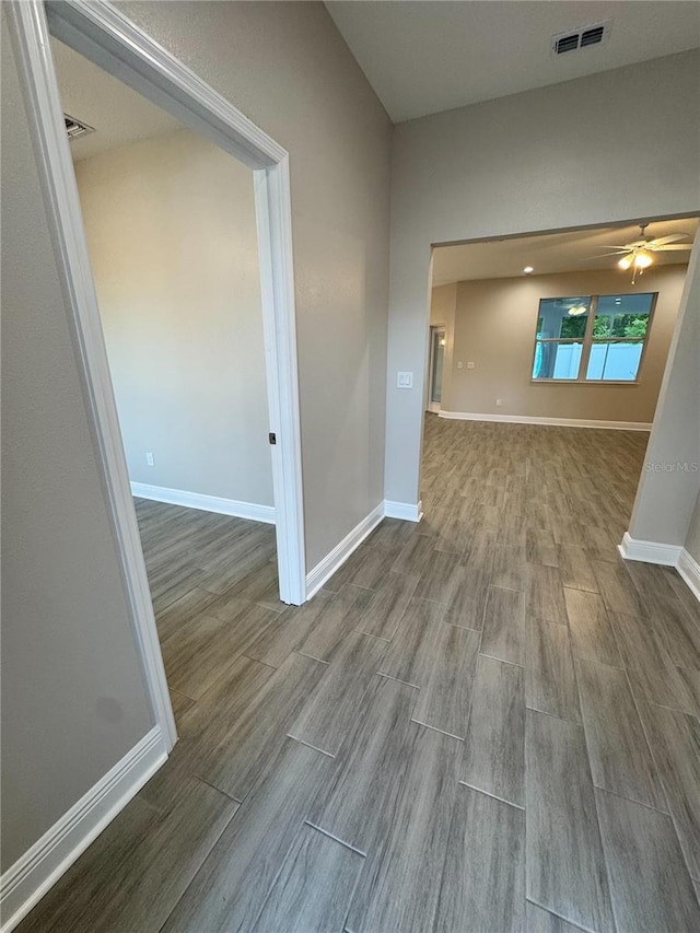 37565 Teri Ct, Dade City, FL 33525 - interior space with baseboards, wood finished floors, and visible vents