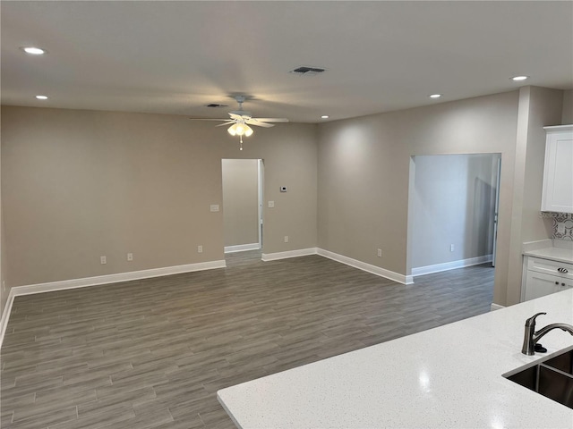 37565 Teri Ct, Dade City, FL 33525 - kitchen featuring recessed lighting, wood finished floors, visible vents, and a ceiling fan