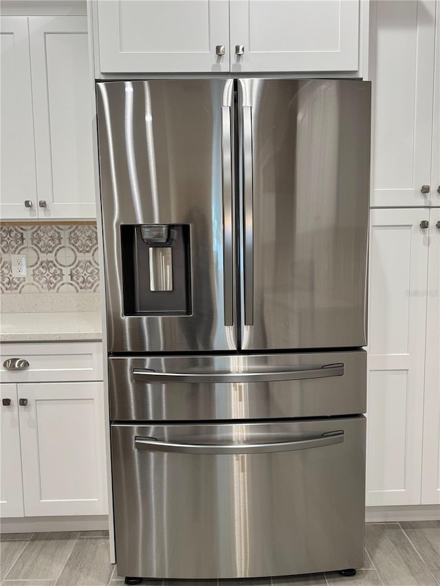 37565 Teri Ct, Dade City, FL 33525 - details featuring decorative backsplash and stainless steel fridge with ice dispenser