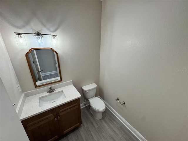 37565 Teri Ct, Dade City, FL 33525 - half bathroom with baseboards, vanity, and toilet