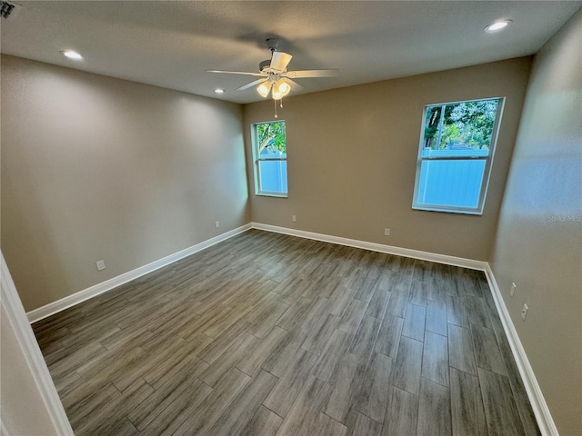 37565 Teri Ct, Dade City, FL 33525 - unfurnished room with dark wood-style floors, visible vents, baseboards, recessed lighting, and ceiling fan