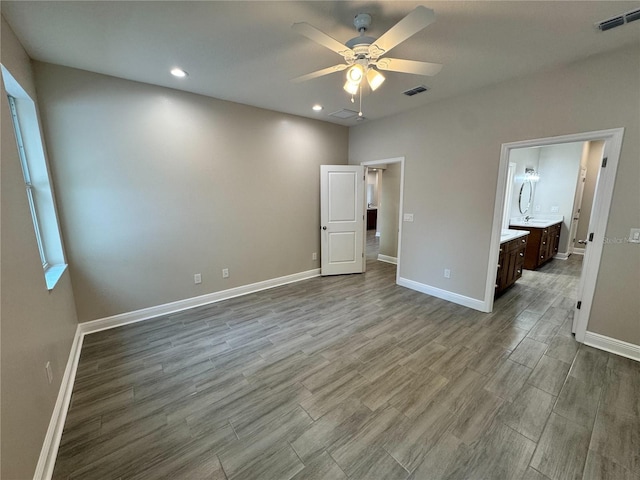 37565 Teri Ct, Dade City, FL 33525 - unfurnished bedroom featuring wood finished floors, visible vents, and baseboards