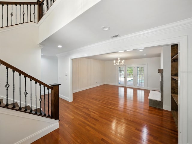 13004 Bell Creek Chase, Riverview, FL 33569 - interior space featuring wood finished floors, stairs, an inviting chandelier, ornamental molding, and visible vents