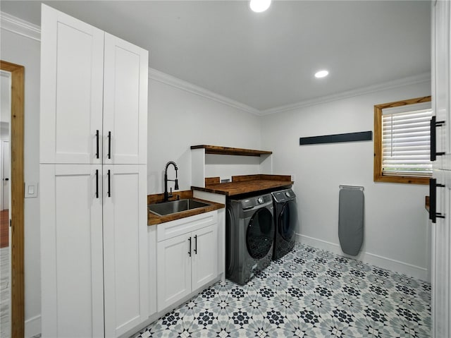 13004 Bell Creek Chase, Riverview, FL 33569 - clothes washing area with washer and clothes dryer, a sink, baseboards, cabinet space, and ornamental molding