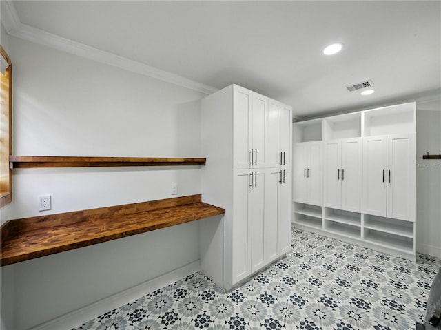 13004 Bell Creek Chase, Riverview, FL 33569 - mudroom with built in desk, baseboards, visible vents, recessed lighting, and crown molding
