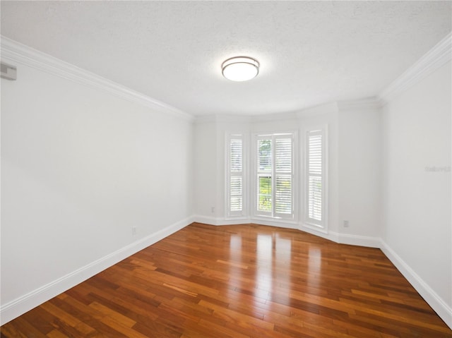 13004 Bell Creek Chase, Riverview, FL 33569 - spare room featuring hardwood / wood-style flooring, baseboards, and ornamental molding