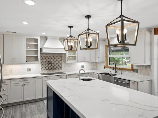 13004 Bell Creek Chase, Riverview, FL 33569 - kitchen with dishwasher, custom exhaust hood, black electric stovetop, and a sink