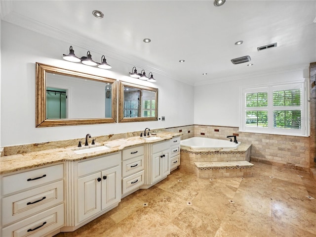 13004 Bell Creek Chase, Riverview, FL 33569 - bathroom featuring a bath, visible vents, crown molding, and a sink