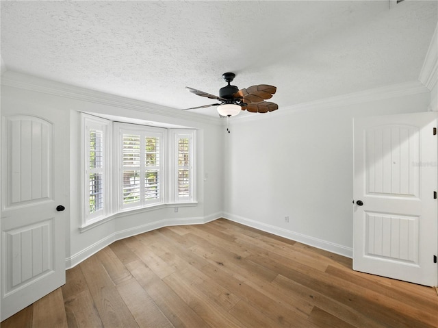 13004 Bell Creek Chase, Riverview, FL 33569 - unfurnished room with crown molding, baseboards, a ceiling fan, and hardwood / wood-style floors