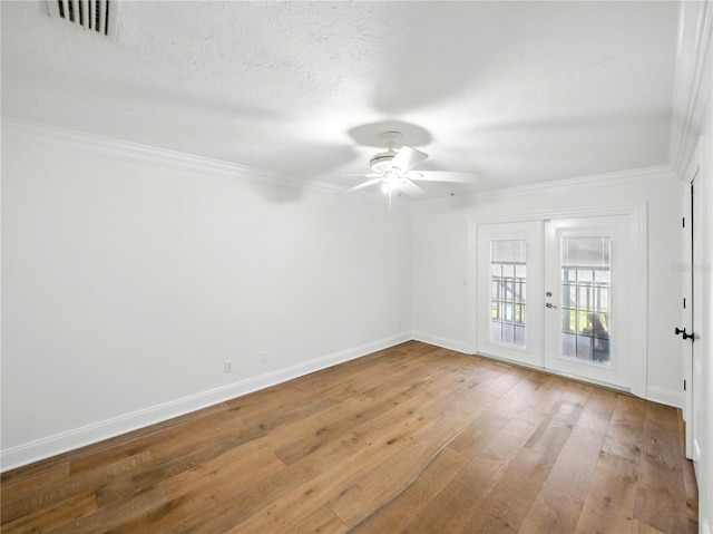 13004 Bell Creek Chase, Riverview, FL 33569 - unfurnished room with light wood-type flooring, french doors, baseboards, ornamental molding, and visible vents