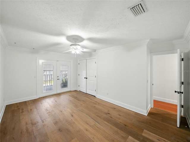 13004 Bell Creek Chase, Riverview, FL 33569 - spare room featuring ceiling fan, french doors, wood-type flooring, and visible vents