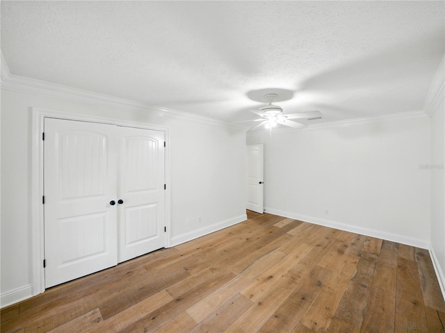 13004 Bell Creek Chase, Riverview, FL 33569 - spare room featuring ceiling fan, baseboards, ornamental molding, and light wood finished floors