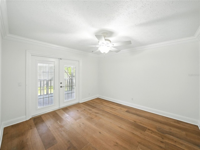 13004 Bell Creek Chase, Riverview, FL 33569 - spare room featuring a textured ceiling, baseboards, ornamental molding, and french doors
