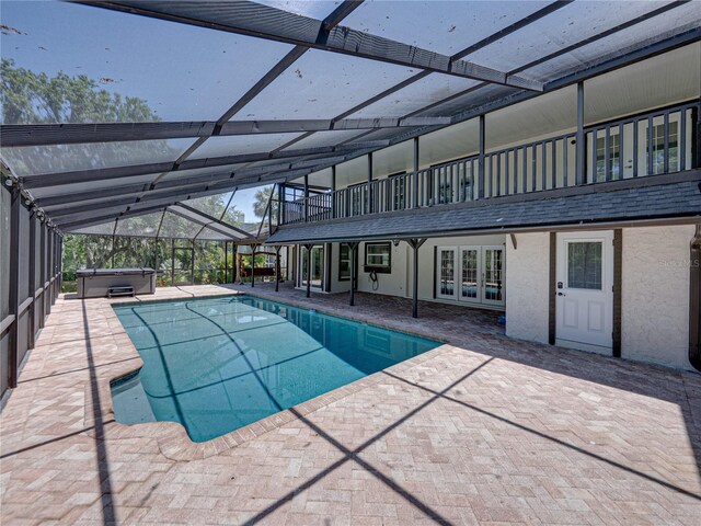 13004 Bell Creek Chase, Riverview, FL 33569 - outdoor pool with french doors, a lanai, a hot tub, and a patio