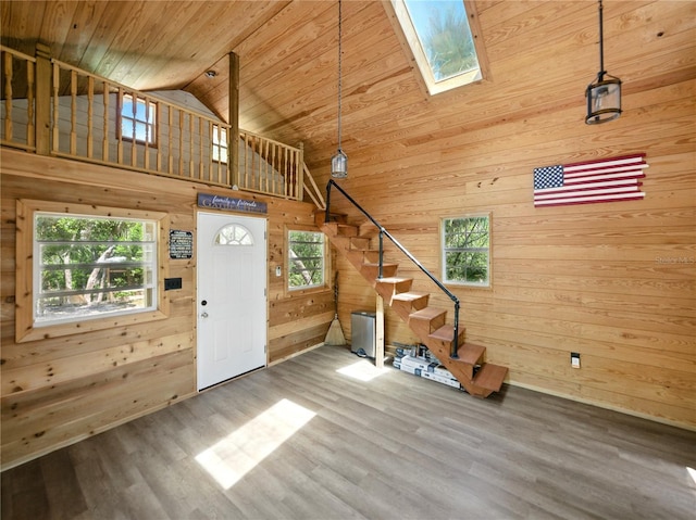 13004 Bell Creek Chase, Riverview, FL 33569 - entrance foyer featuring stairway, wooden walls, wood finished floors, a skylight, and wood ceiling