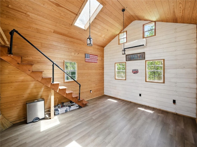 13004 Bell Creek Chase, Riverview, FL 33569 - unfurnished living room featuring wooden ceiling, wood finished floors, wooden walls, and a skylight