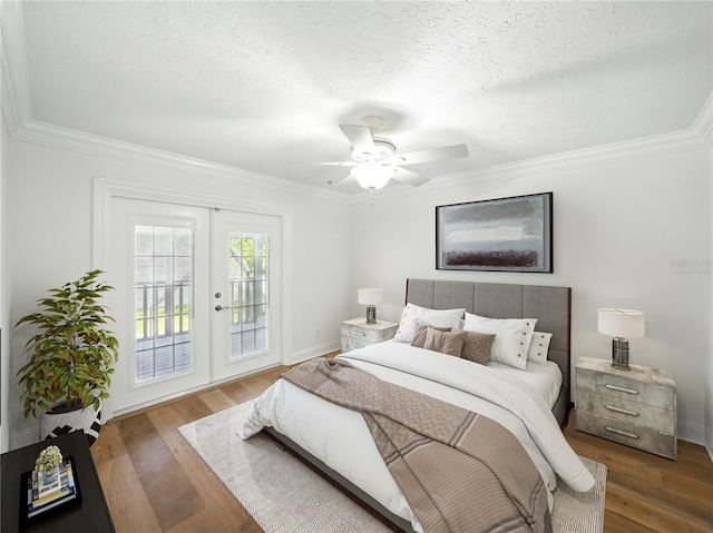 13004 Bell Creek Chase, Riverview, FL 33569 - bedroom featuring wood finished floors, a textured ceiling, and crown molding