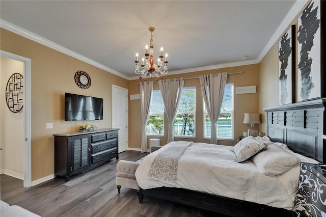 bedroom with an inviting chandelier, crown molding, wood finished floors, and baseboards