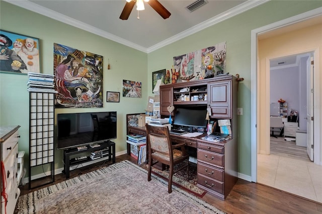 office with wood finished floors, visible vents, crown molding, baseboards, and ceiling fan