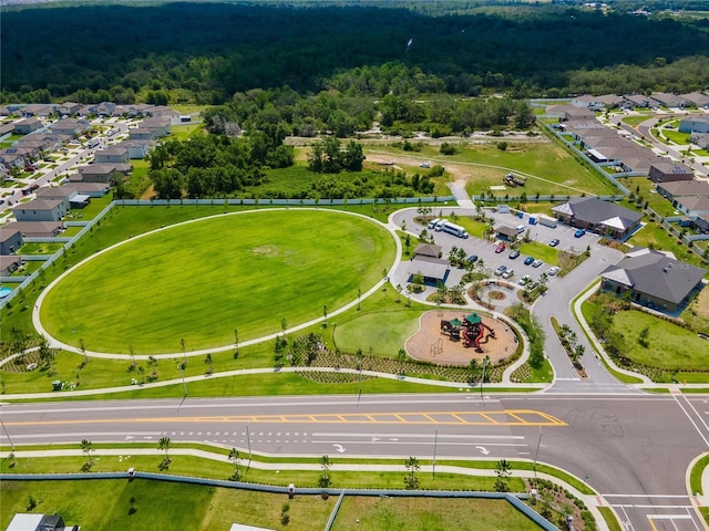 aerial view featuring a residential view and a view of trees