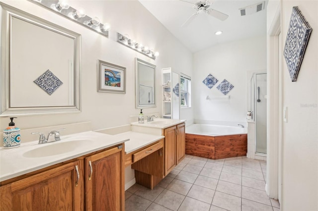 full bath with double vanity, a garden tub, visible vents, a sink, and tile patterned floors