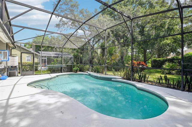 outdoor pool with a lanai and a patio