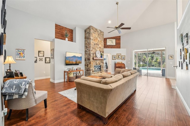 living area with baseboards, high vaulted ceiling, dark wood finished floors, and ceiling fan