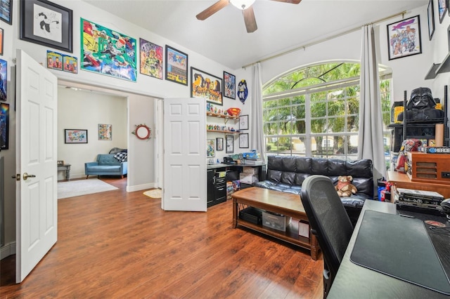 home office with a ceiling fan and wood finished floors