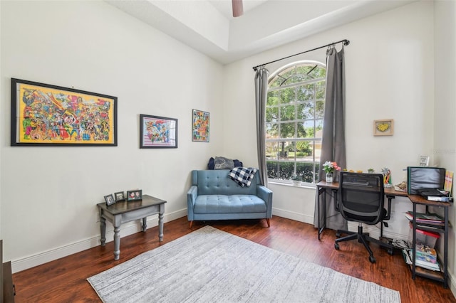 office space with baseboards and wood finished floors