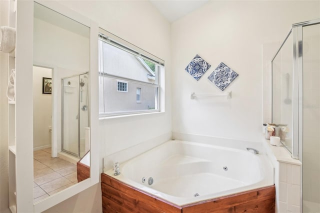 full bath featuring a tub with jets, tile patterned floors, and a shower stall