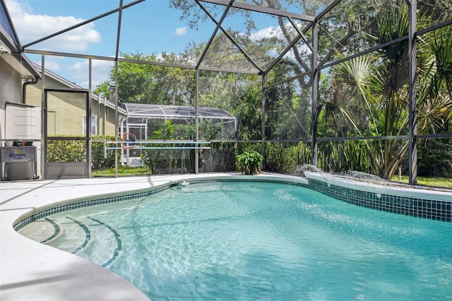 pool with a lanai and a patio