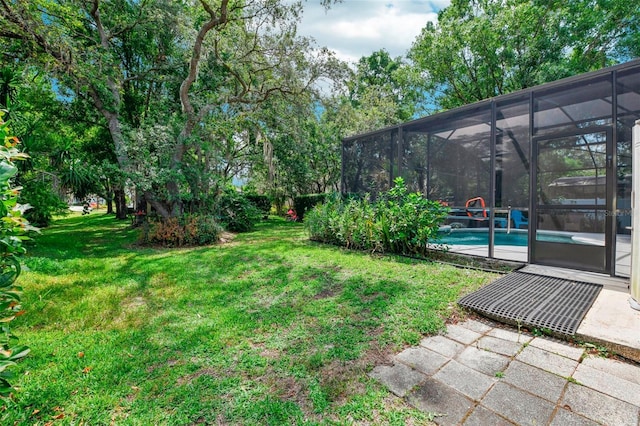 view of yard with a patio area and an outdoor pool