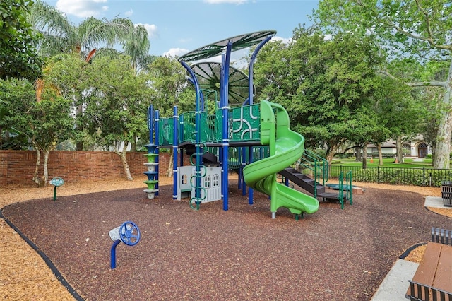 community jungle gym featuring fence