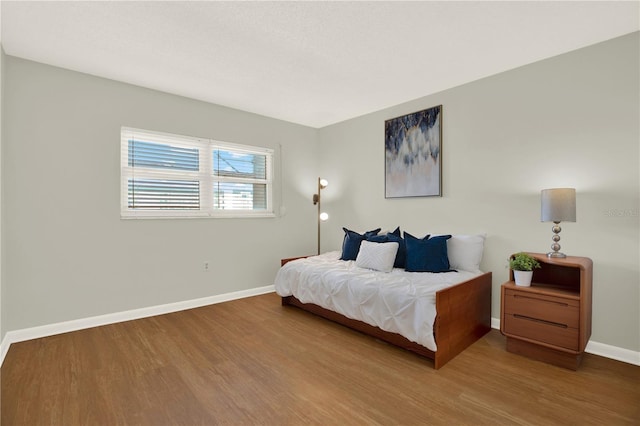 9 Haig Pl Unit 510, Dunedin, FL 34698 - bedroom with baseboards and wood finished floors