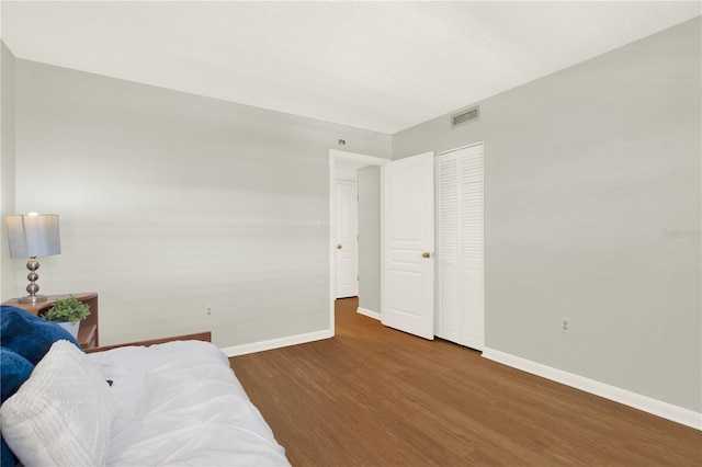 9 Haig Pl Unit 510, Dunedin, FL 34698 - living area featuring baseboards, wood finished floors, and visible vents