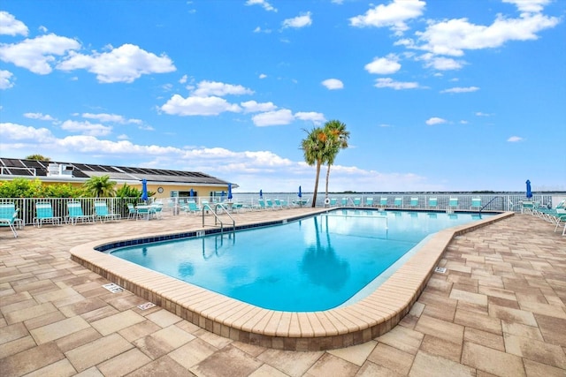 9 Haig Pl Unit 510, Dunedin, FL 34698 - community pool with a patio and fence