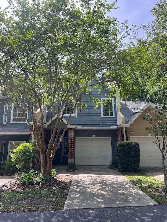 554 NW 50th Blvd, Gainesville, FL 32607 - traditional-style house featuring an attached garage and driveway