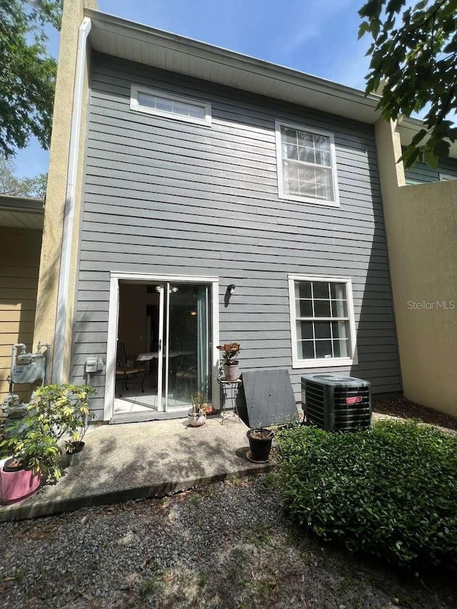 554 NW 50th Blvd, Gainesville, FL 32607 - rear view of property with a patio and cooling unit