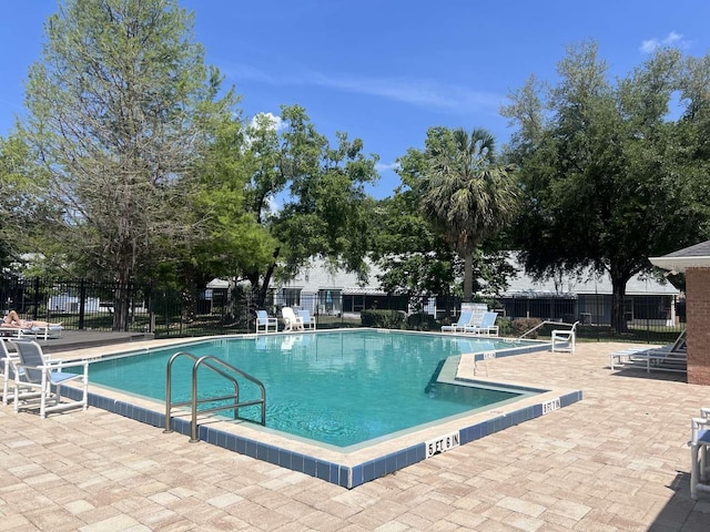 554 NW 50th Blvd, Gainesville, FL 32607 - pool with a patio and fence