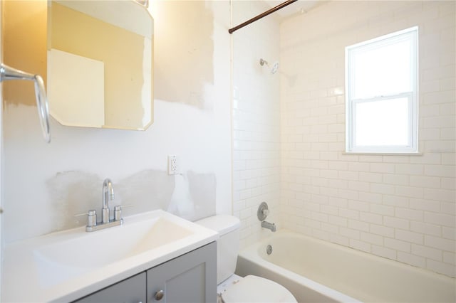 bathroom with washtub / shower combination, toilet, and vanity